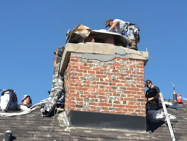 Hemet Chimney Sweep installing a custom chimney crown in Hemet, CA
