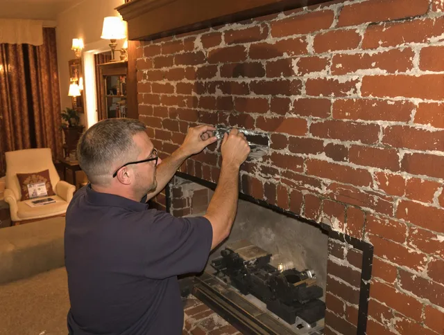 Hemet Chimney Sweep expert fixing a fireplace in Hemet, CA